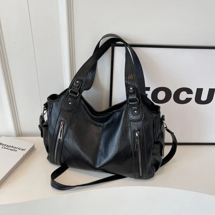 Casual shoulder bag with zippers and adjustable strap