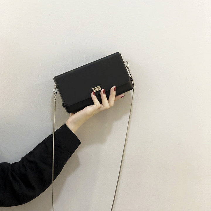 Women's clutch bag with elegant flap closure and innovative design