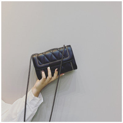 Women's clutch with stylish quilted design and detachable chain strap