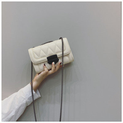 Women's clutch with stylish quilted design and detachable chain strap