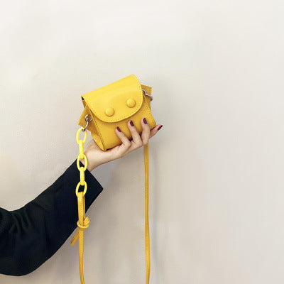 Women’s mini handbag with playful chain pull