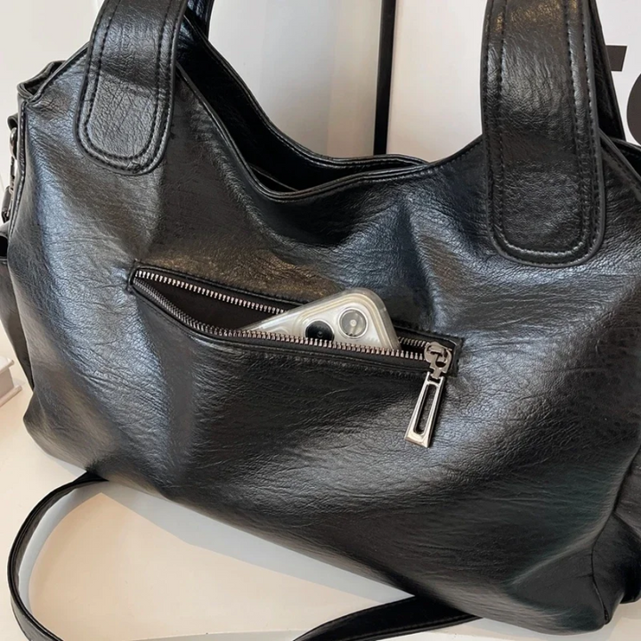 Casual shoulder bag with zippers and adjustable strap