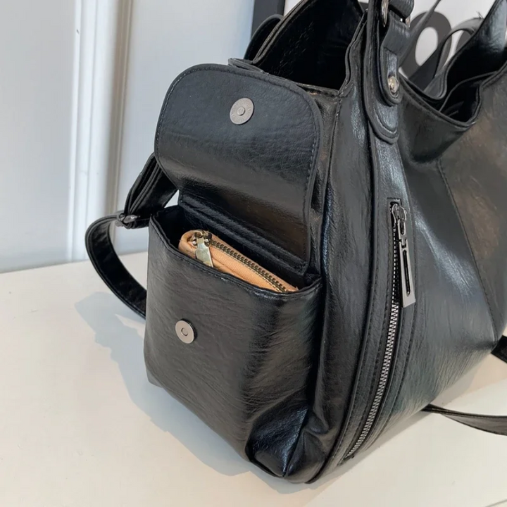 Casual shoulder bag with zippers and adjustable strap