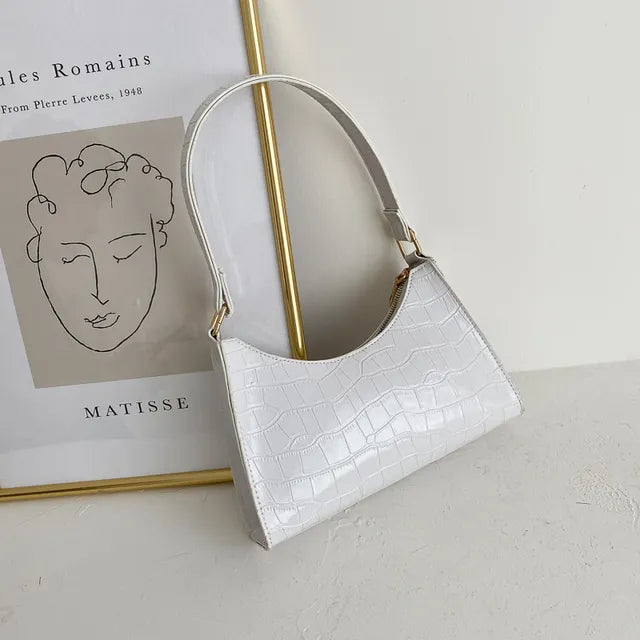 Women's leather shoulder bag in retro style