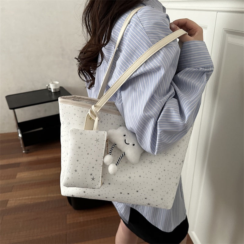 Women's large tote bag with sparkling star design and detachable cosmetic pouch