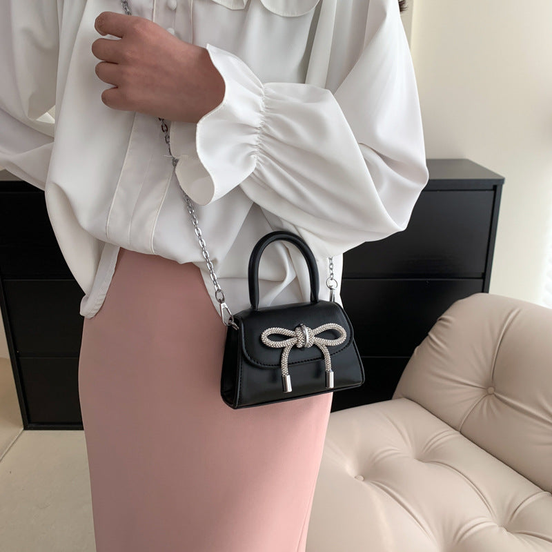 Women’s mini handbag with elegant chain closure