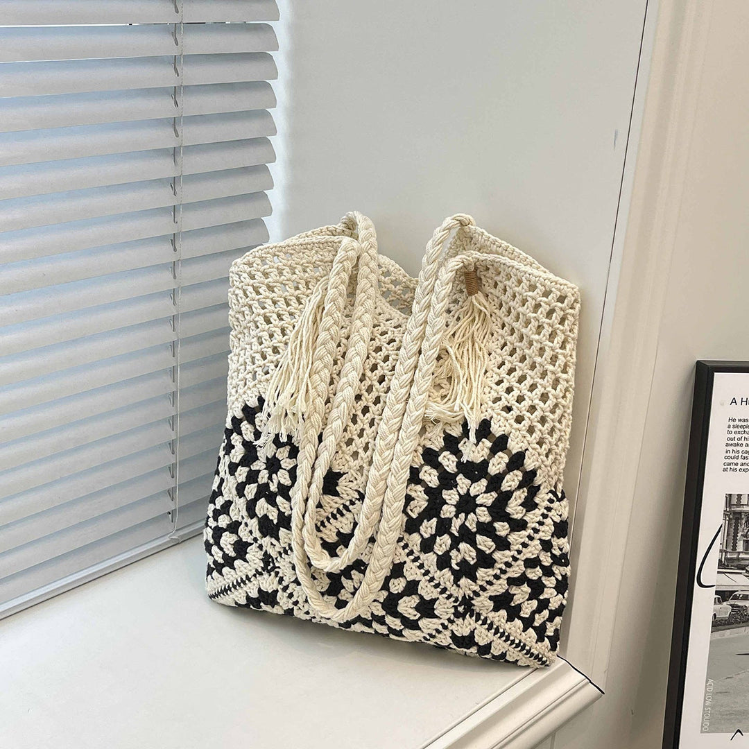 Ladies crocheted shoulder bag with playful sunflower appliqués