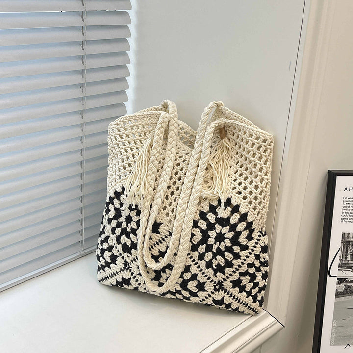 Ladies crocheted shoulder bag with playful sunflower appliqués