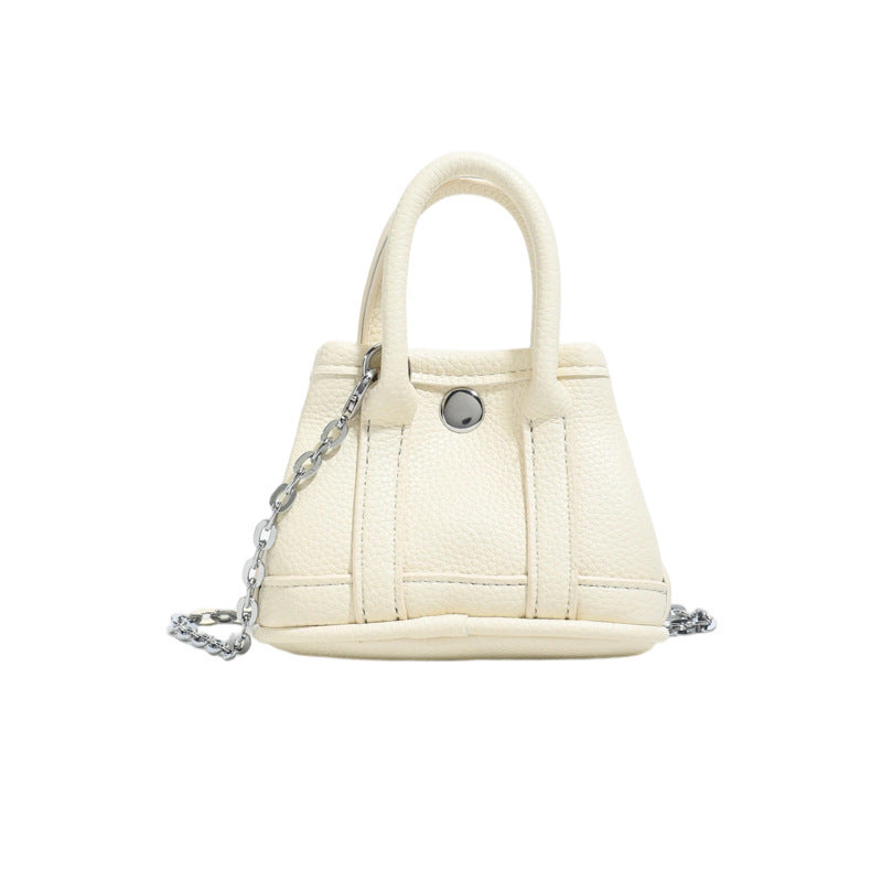 Ladies mini handbag with smooth structure and removable chain strap