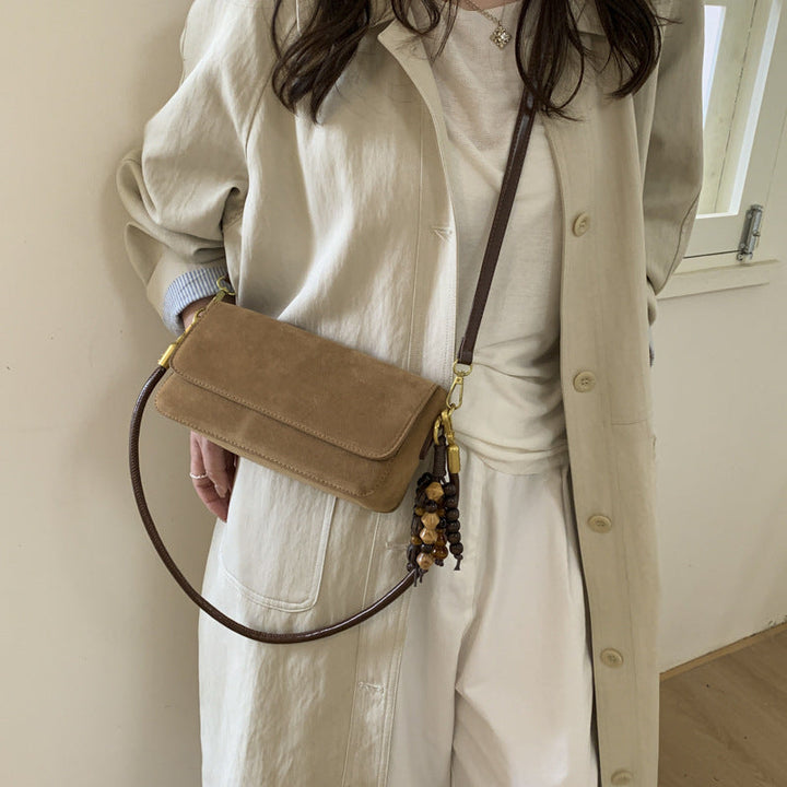 Women's shoulder bag made of fine suede leather with practical shoulder strap