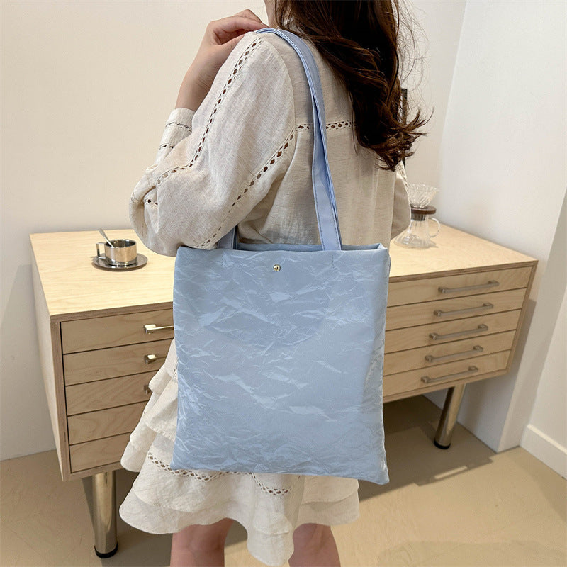 Women's tote bag made of high-quality synthetic leather with a textured surface