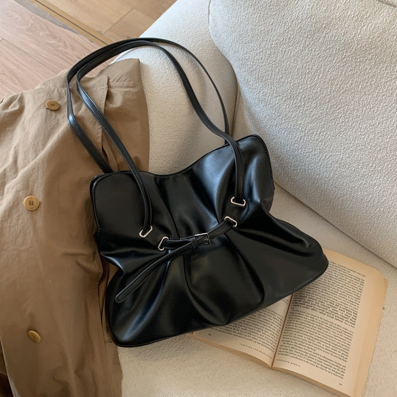 Women's shoulder bag made of high-quality synthetic leather with adjustable drawstring
