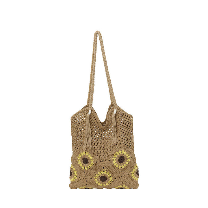 Ladies crocheted shoulder bag with playful sunflower appliqués