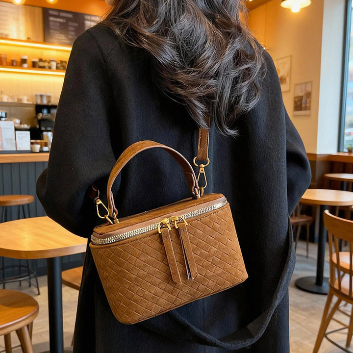Women's structured shoulder bag with detachable carrying strap
