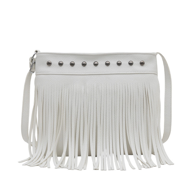 Ladies shoulder bag with fringes and studs