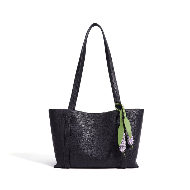 Ladies stylish tote bag with floral pendant