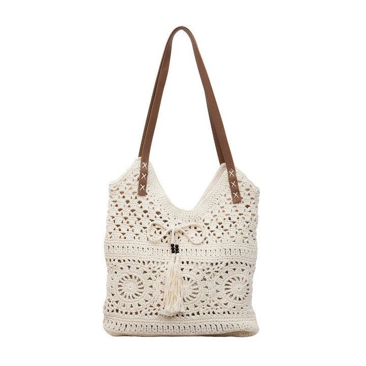 Ladies' crochet shoulder bag with playful fringes and decorative details