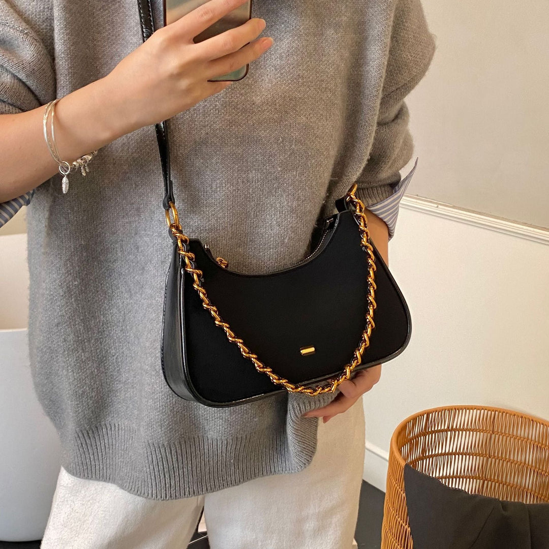 Women's fashionable shoulder bag in vintage look with chain strap