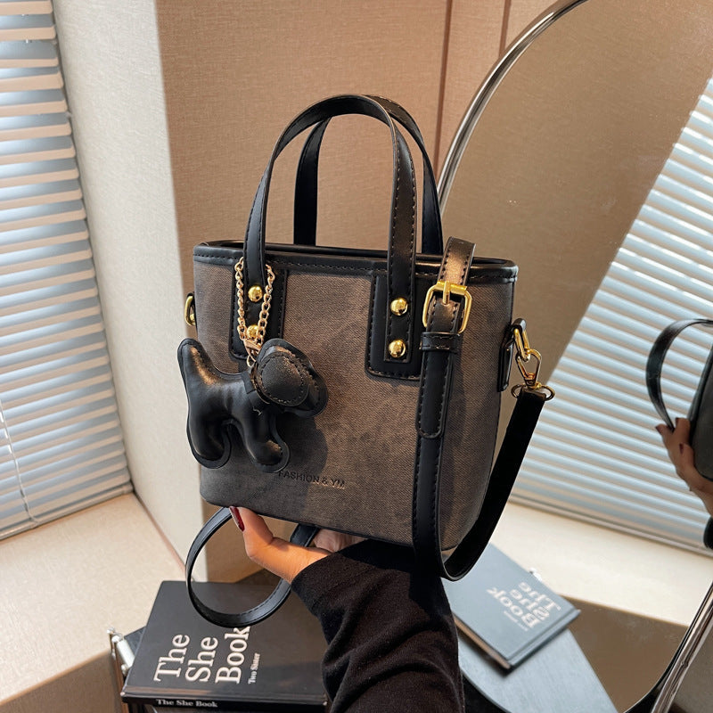 Women's mini bag made of high-quality material with removable funny charm