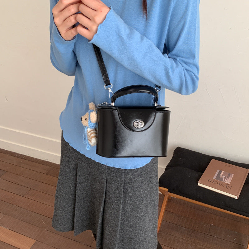 Women’s mini handbag with cute animal pendant