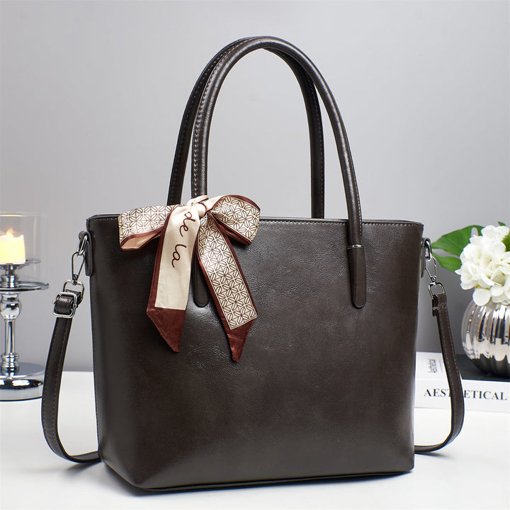 Women's elegant shoulder bag with playful bow accent