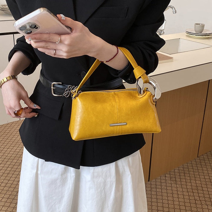Ladies elegant handbag with minimalist design and noble accents
