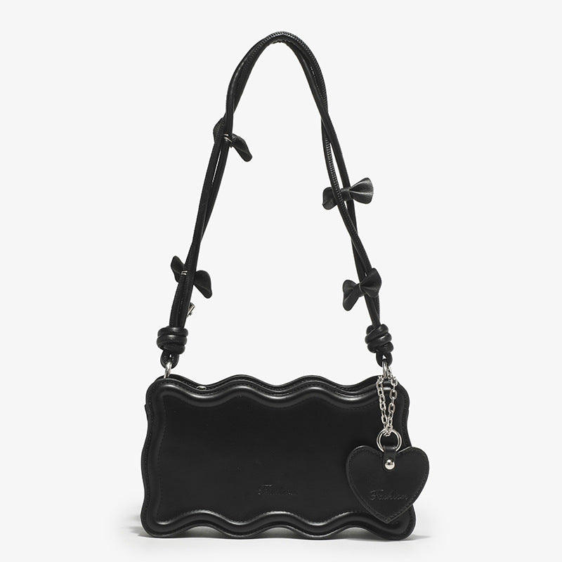 Women's mini handbag with creative wave pattern and playful pendant