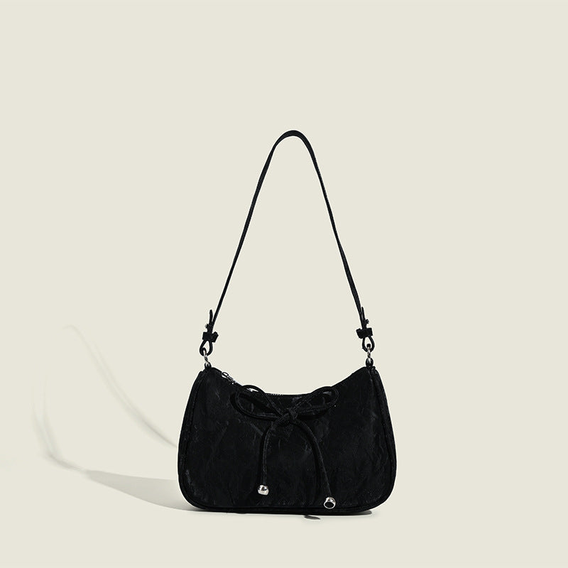 Ladies elegant mini handbag with playful drawstring