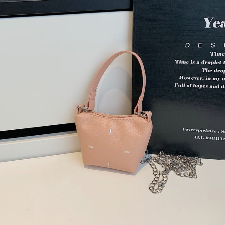Women's mini handbag with shiny chain and textured upper material