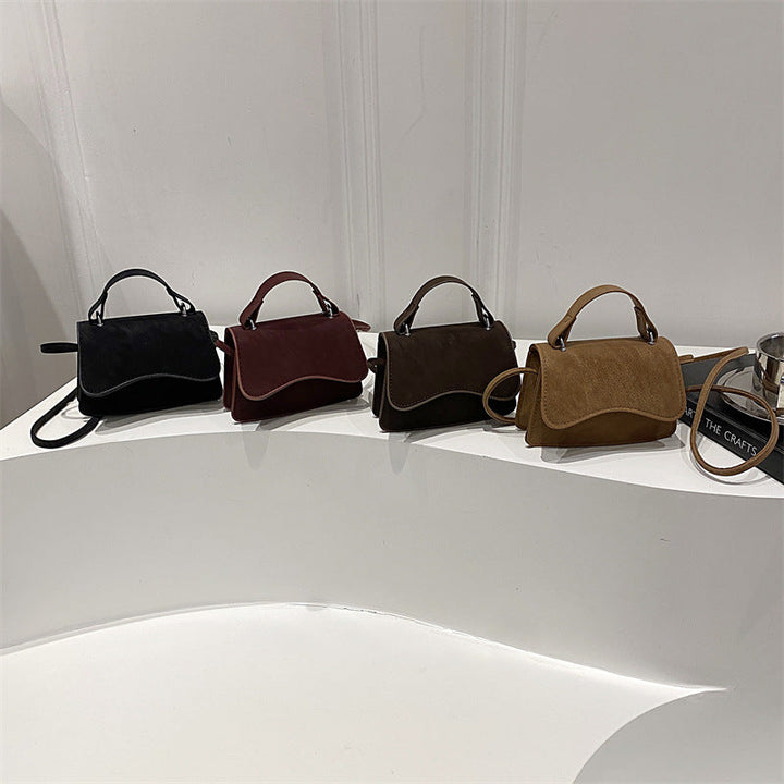 Women's mini handbag with removable carry handle