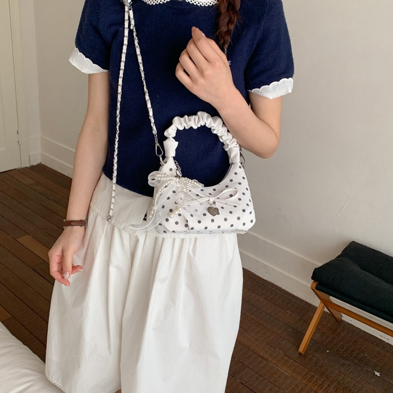 Women's mini handbag with decorative accents