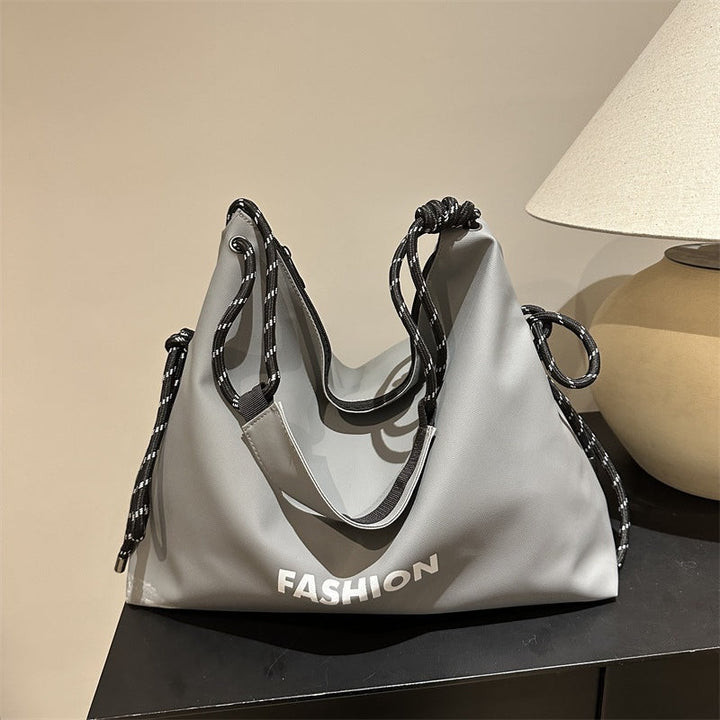 Women's stylish tote bag with braided drawstring