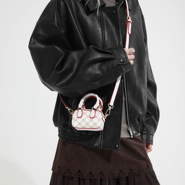 Ladies mini handbag with luxurious accents and adjustable shoulder strap