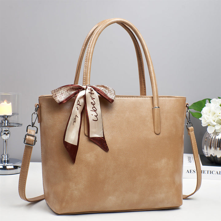 Women's elegant shoulder bag with playful bow accent