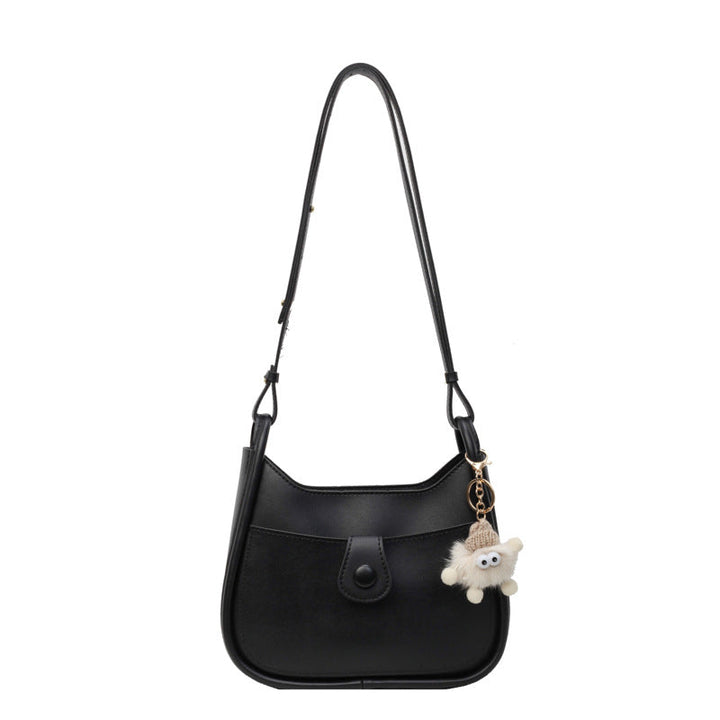 Women's shoulder bag made of high-quality synthetic leather with playful charm
