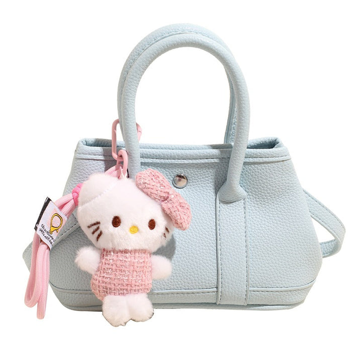 Women’s mini handbag with playful plush pendant