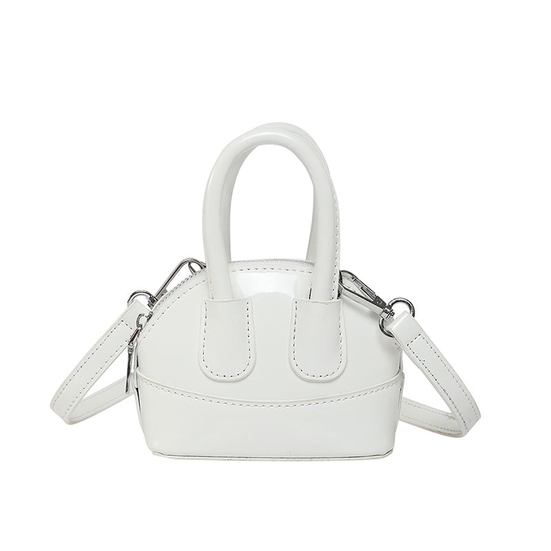 Ladies mini handbag with elegant glossy finish and removable shoulder strap