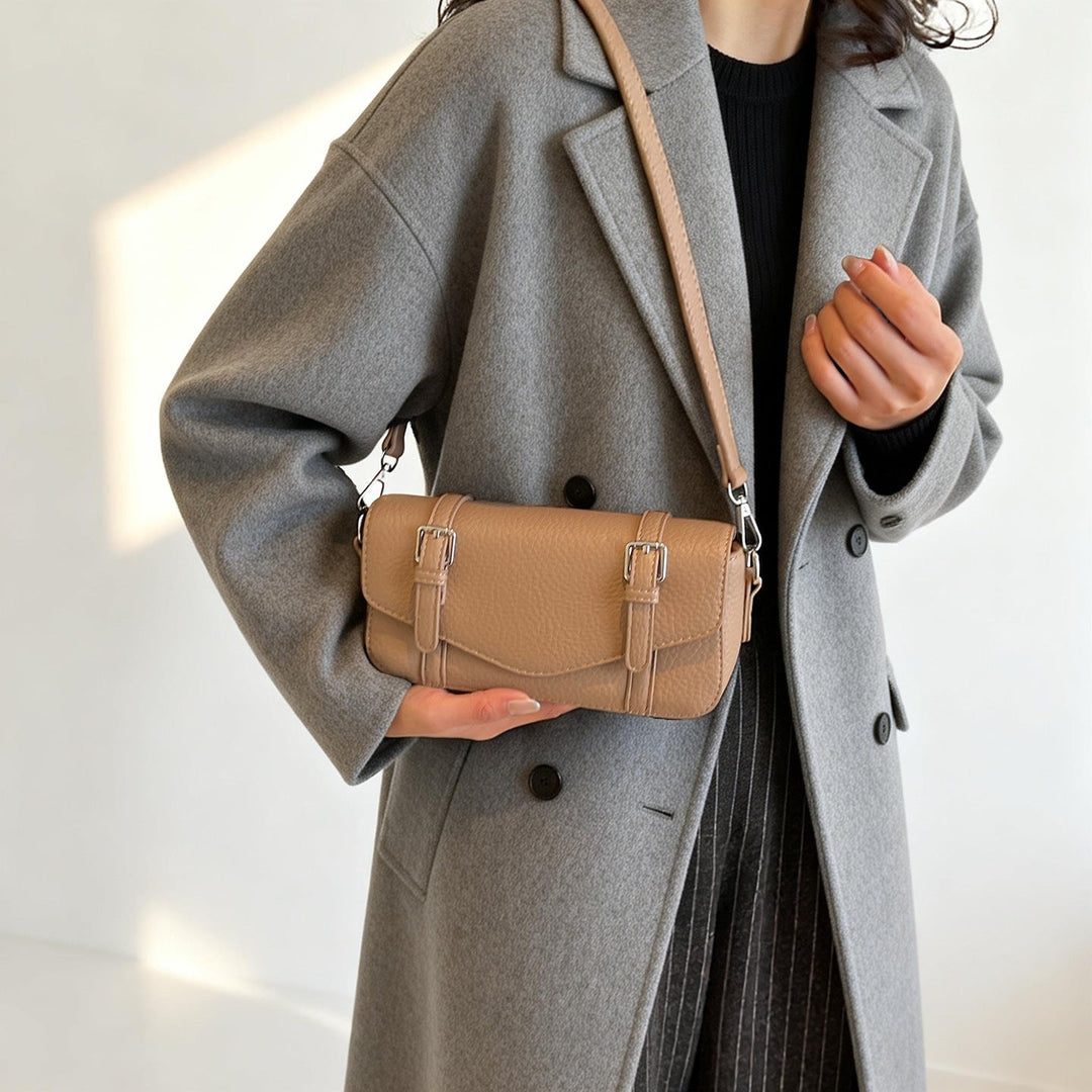 Women's elegant shoulder bag made of textured synthetic leather with adjustable shoulder strap
