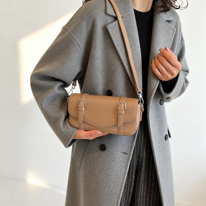 Women's elegant shoulder bag made of textured synthetic leather with adjustable shoulder strap