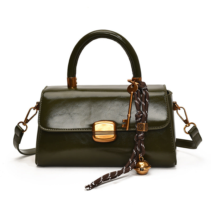 Women's elegant handbag with golden accents