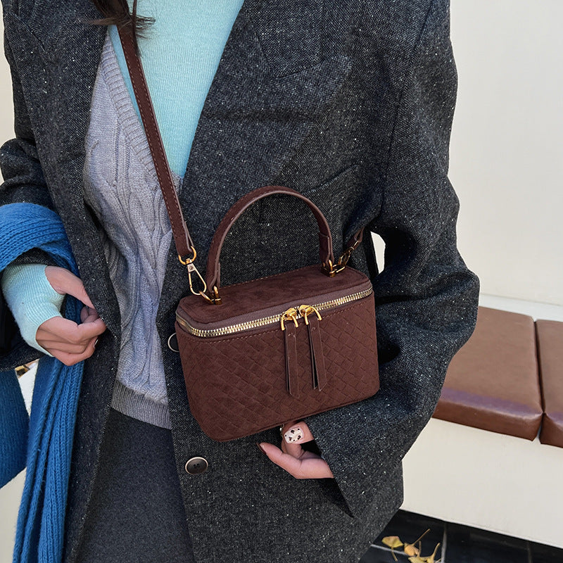 Women's structured shoulder bag with detachable carrying strap