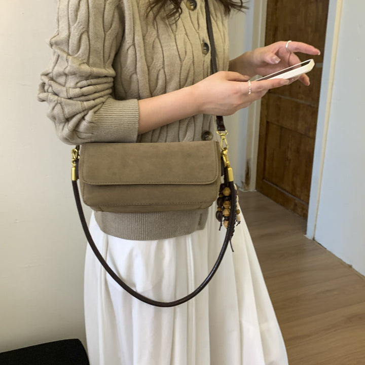 Women's shoulder bag made of fine suede leather with practical shoulder strap