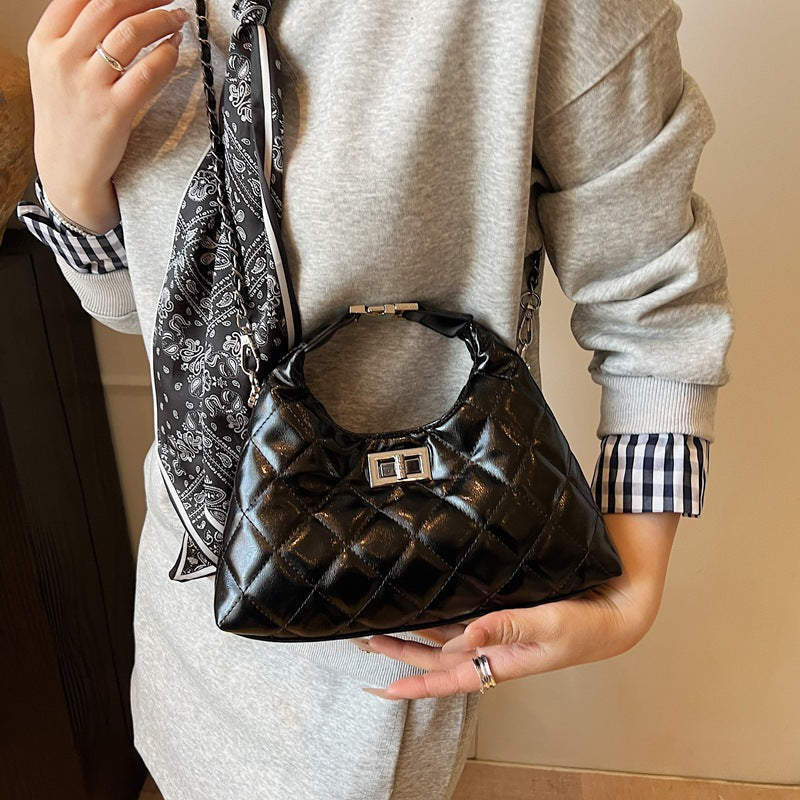 Women's mini bag with elegant quilted design and chic chain closure