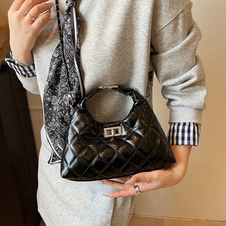 Women's mini bag with elegant quilted design and chic chain closure