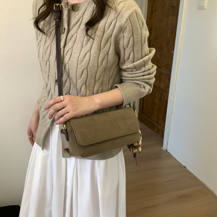 Women's shoulder bag made of fine suede leather with practical shoulder strap
