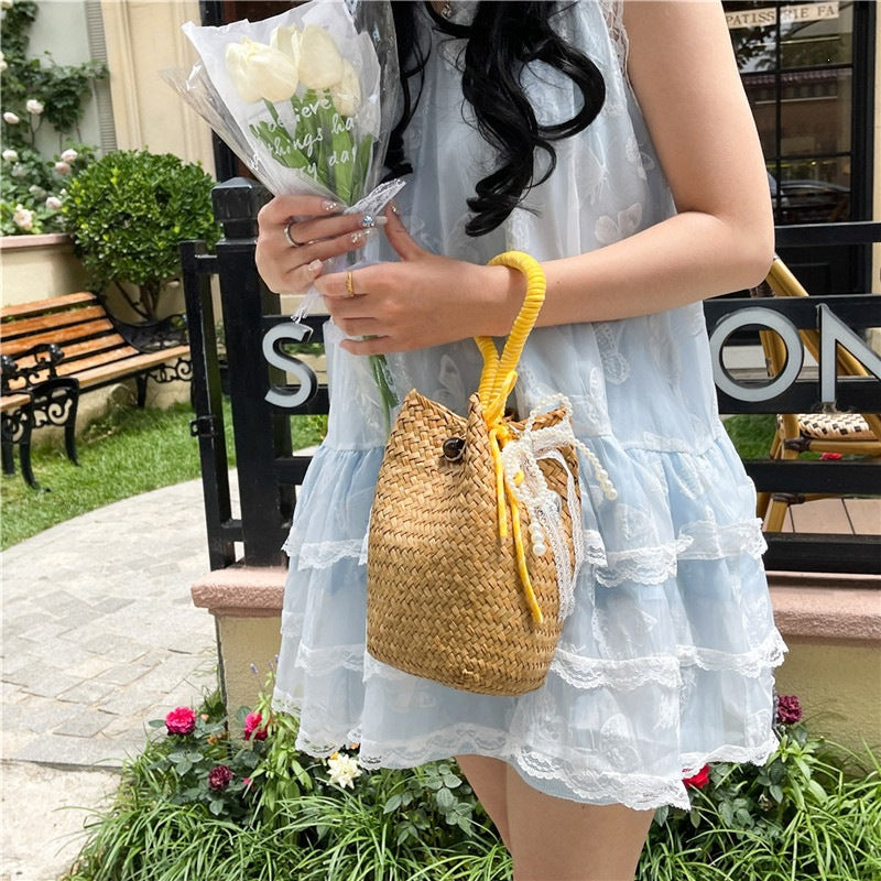 Women's hand-woven shoulder bag with decorative drawstring