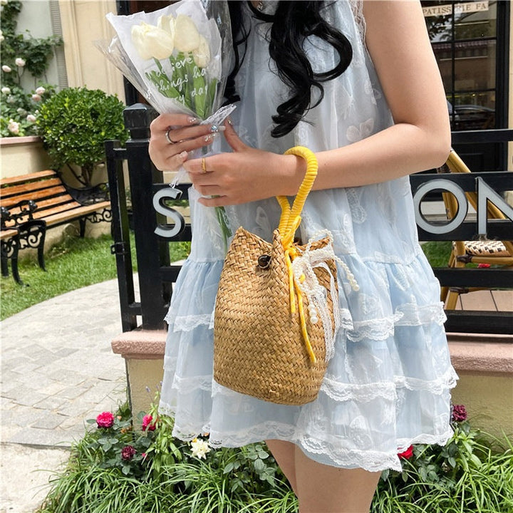 Women's hand-woven shoulder bag with decorative drawstring