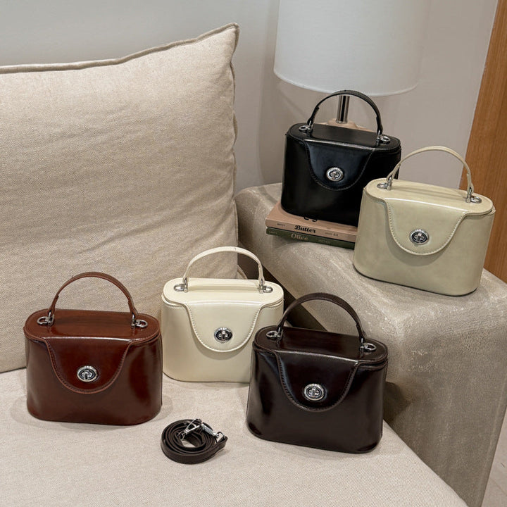 Ladies elegant mini handbag with stylish charm