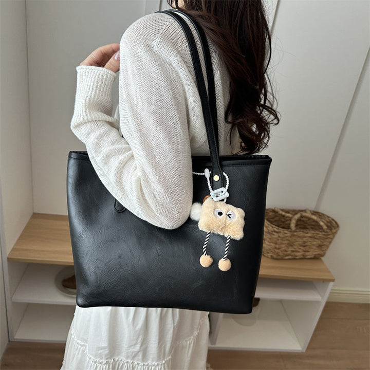 Women's classic tote bag with charming plush toy pendant