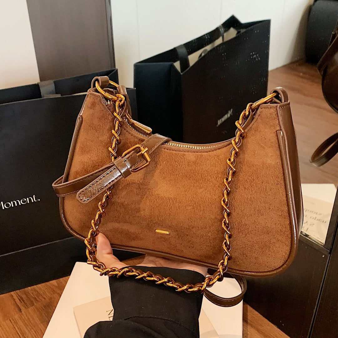 Women's fashionable shoulder bag in vintage look with chain strap